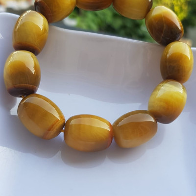 Vòng Tay Phong Thủy Nam Mệnh Thổ Kim Thủy Mới Đẹp Hạt Lu Thống Mới Vàng Nâu bóng đẹp Chất liệu đá mắt hổ tự nhiên vàng nâu bóng đẹp ạ Size hạt 14mm x dài 19mm ạ