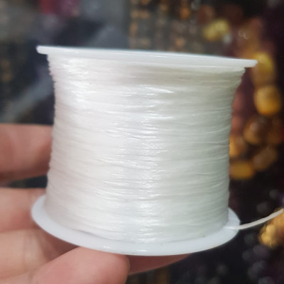 Cuộn Dây Thun CO GIÃN màu Trắng xỏ vòng hạt chuỗi Dây này là dây thun chuyên xỏ vòng chuỗi màu Trắng, có đủ màu Anh Chị đang đeo chuỗi muốn thay dây khác cho vòng thì đặt cuộn Thun chỉ này nhé 