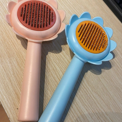 CÓ HỘP - Lược chải lông gỡ rối cho chó mèo hình hoa dướng dương có nút bấm đẩy lông thừa