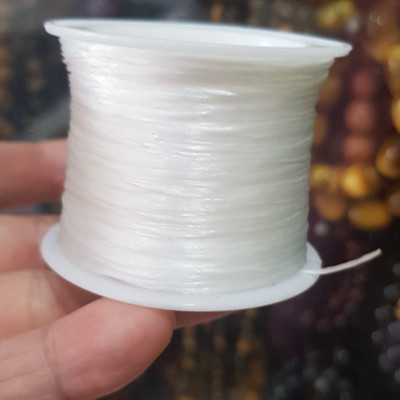 Cuộn Dây Thun CO GIÃN màu Trắng xỏ vòng hạt chuỗi Dây này là dây thun chuyên xỏ vòng chuỗi màu Trắng, có đủ màu Anh Chị đang đeo chuỗi muốn thay dây khác cho vòng thì đặt cuộn Thun chỉ này nhé 