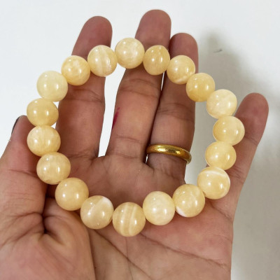 Vòng tay chuỗi hạt ngọc thật màu vàng cam cho người mệnh Thổ và hỏa đường kính hột 10 li (1cm)